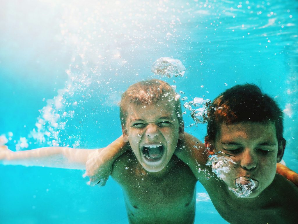 Kids playing under water